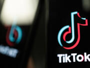 In this photo illustration, a TikTok logo is displayed on an iPhone on Feb. 28, 2023, in London. TikTok&Ccedil;&fnof;&Ugrave;s &ldquo;very demure&rdquo; trend has taken the internet by storm and transformed a former cashier from Chicago into an internet phenomenon.