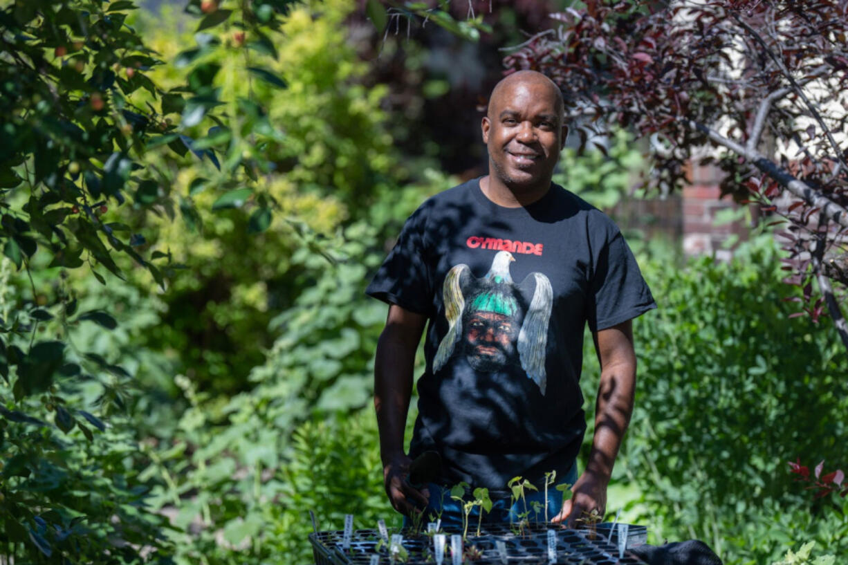 Artist Lamar Peterson is also a voracious gardener. Here he is pictured in the backyard of his south Minneapolis home.