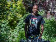 Artist Lamar Peterson is also a voracious gardener. Here he is pictured in the backyard of his south Minneapolis home.