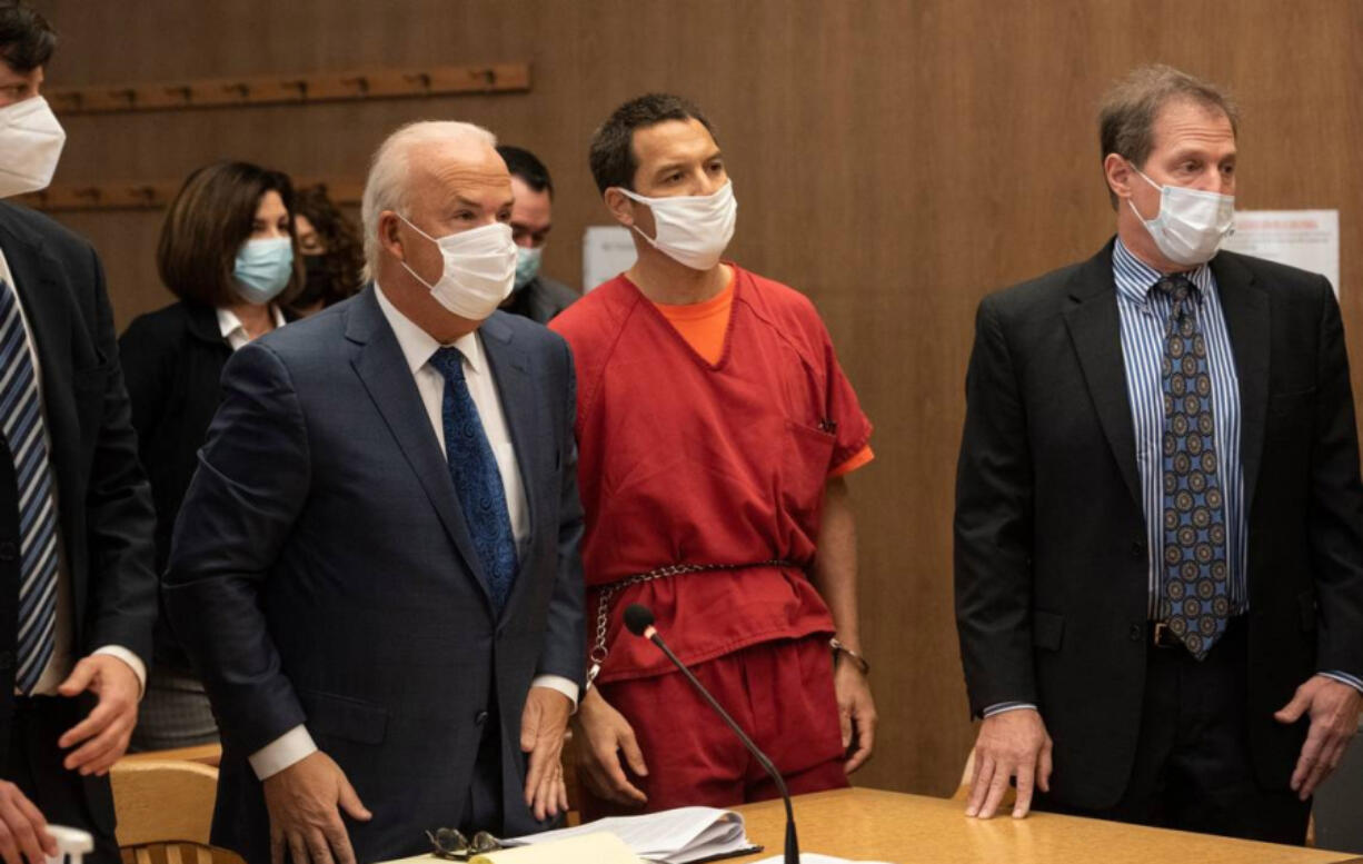 Scott Peterson and his council stand as Judge Anne-Christine Massullo enters the room Dec. 8, 2021, during a resentencing hearing at the San Mateo County Superior Court in Redwood City, Calif.