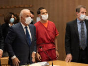 Scott Peterson and his council stand as Judge Anne-Christine Massullo enters the room Dec. 8, 2021, during a resentencing hearing at the San Mateo County Superior Court in Redwood City, Calif.