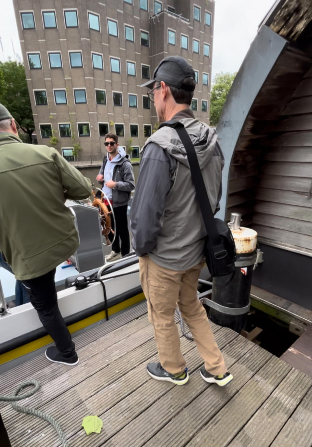 American tourists board a boat for a ride through the canals of Amsterdam on July 5. Local residents throughout Europe say they are looking for more respect and fewer demands from the increasing number of visitors.