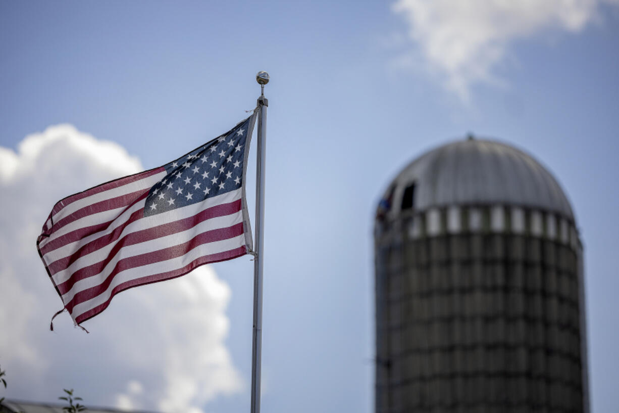 Wind blows an American flag at the Al &amp; Lisa Hass farm in Westby, Wisconsin, on July 16, 2024.