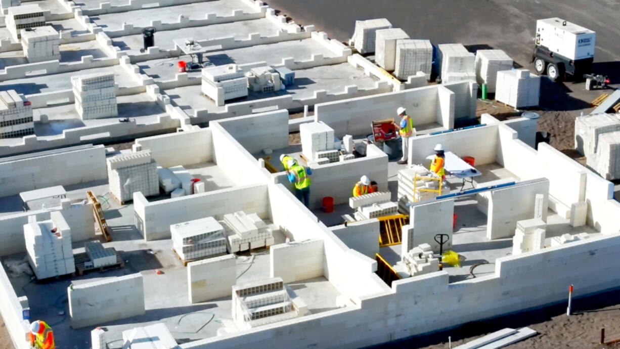 The first stage of construction of a first-of-its kind apartment building in Palm Beach County, Florida. It was built with blocks made of recycled glass, plastic and other materials that fit together like Lego pieces. A Miami company that developed the systems says it can lead to cheaper, greener buildings.