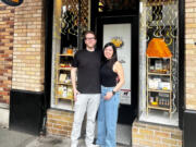 Andy and Tiffany Regan stand in front of their newly opened Camas Cheese Co. shop at 231 N.E. Fourth Ave., in downtown Camas earlier this month.