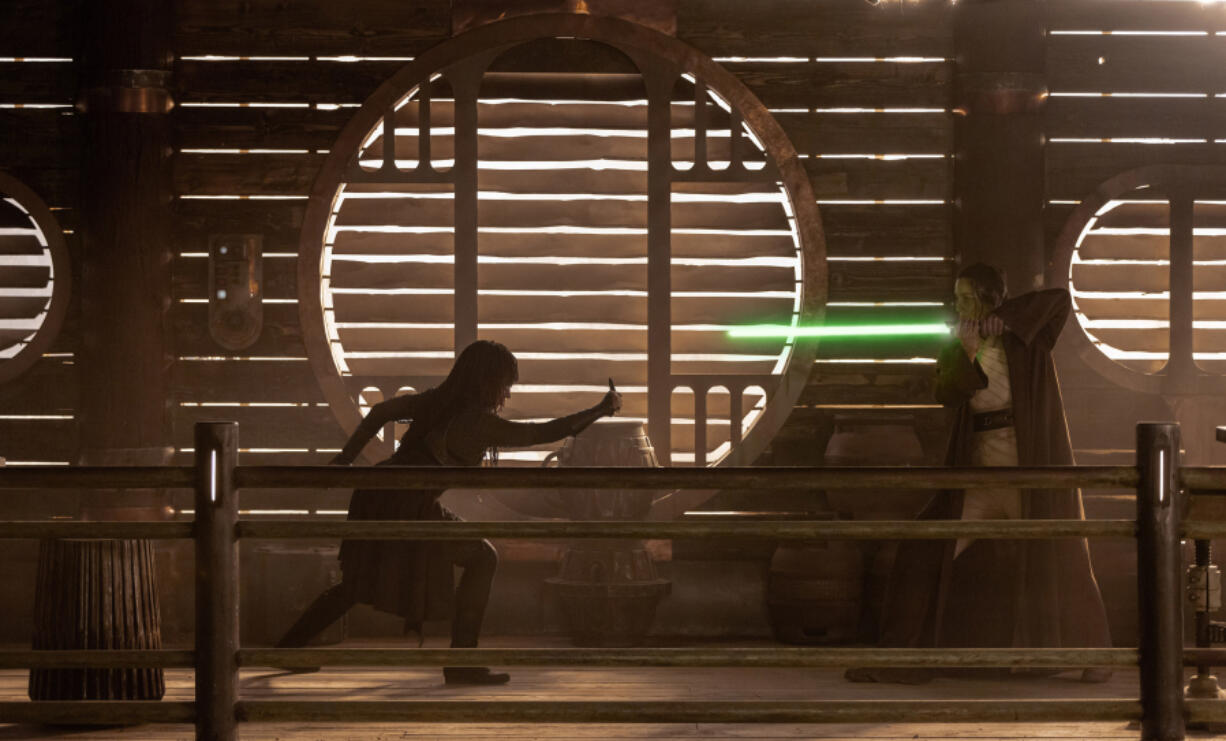 May, portrayed by Amandla Stenberg, left, attacks Jedi Master Indara, played by Carrie-Anne Moss, in the opening moments of the first episode of &Ccedil;&fnof;&uacute;Star Wars: The Acolyte.&Ccedil;&fnof;&ugrave; (Christian Black/Disney+/Lucasfilm Ltd./TNS)