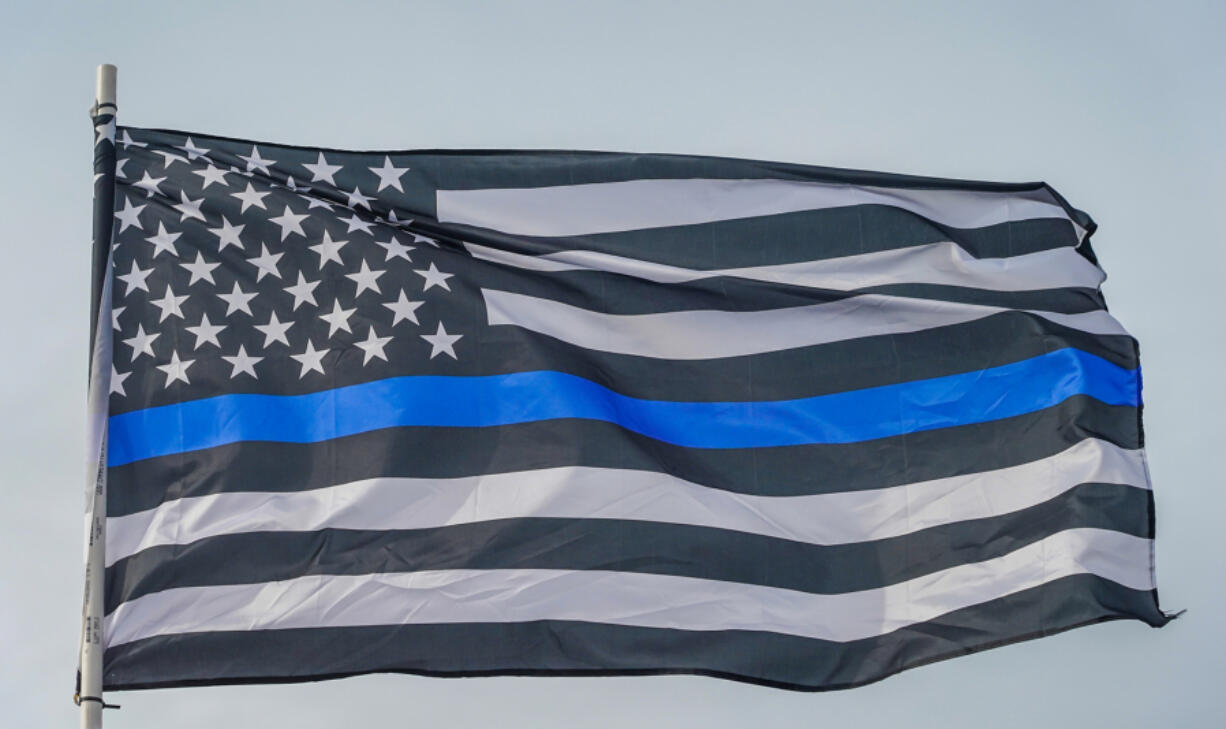 In a settlement reached with the family of a 37-year-old Black man shot and killed by Olympia police in 2022, the city will pay $600,000 and has agreed to ban officers from the &ldquo;personalization&rdquo; of their equipment, effectively bringing to an end the display of polarizing symbols like the &ldquo;thin blue line&rdquo; flag.