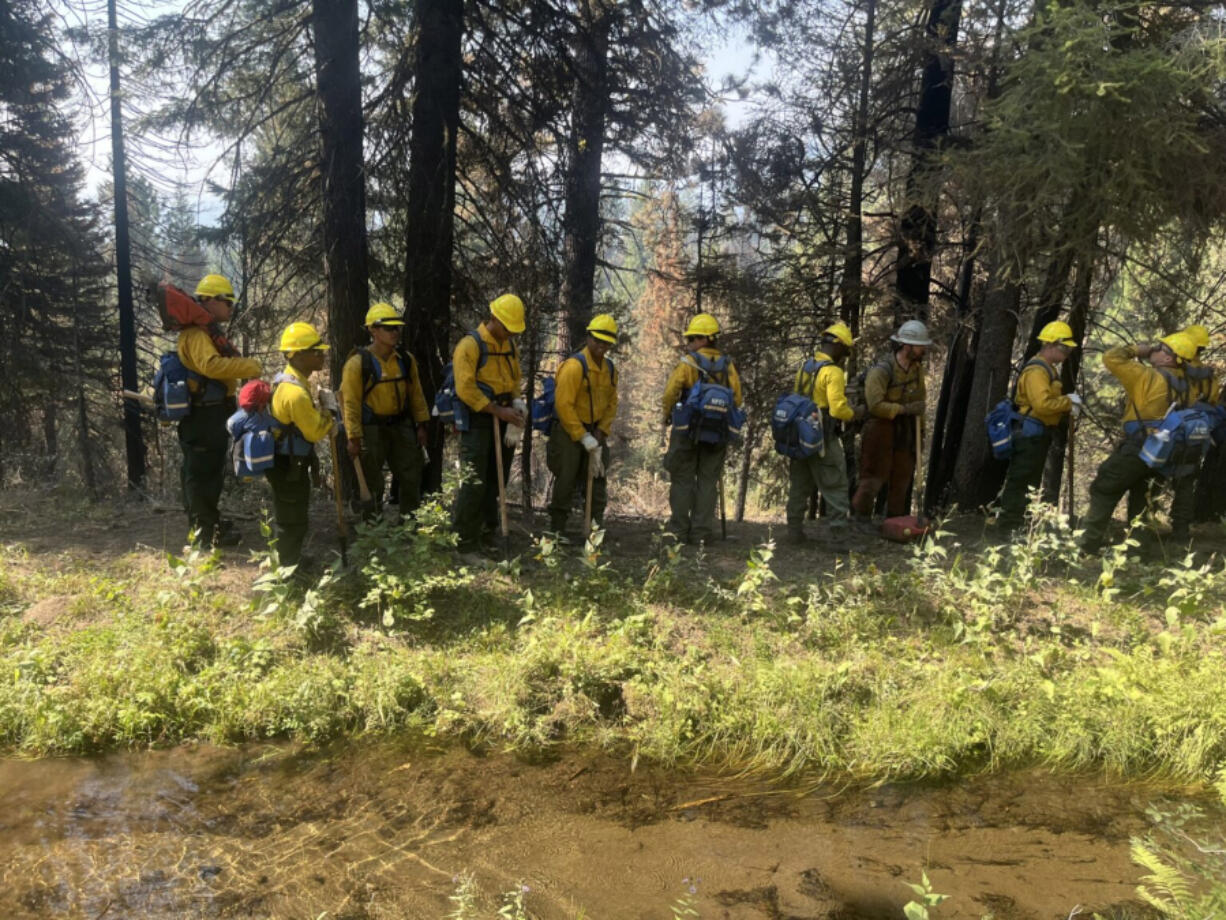 U.S. Army soldiers with the 14th Brigade Engineer Battalion walk a grid pattern fighting the Boulder Fire in Idaho&rsquo;s Boise National Forest on Aug. 22, 2024.