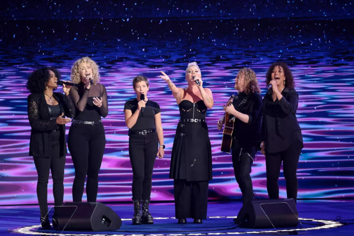 Pink, with daughter Willow and others, perform during the Democratic National Convention on Aug. 22, in Chicago, where Beyonce was falsely rumored to appear as well. (Myung J.