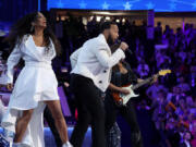 Sheila E., left, and John Legend perform Aug. 21 during the Democratic National Convention in Chicago.