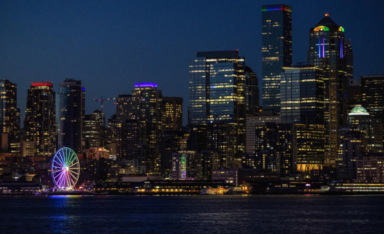 The Seattle Great Wheel shines brightly in the colors of the rainbow to mark the 50th anniversary of Seattle Pride on May 30.