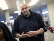 Sen. John Fetterman, D-Pa., walks to the Senate chamber at the Capitol on April 23 in Washington, D.C.