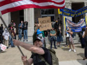 Pro-Israel protesters wave an American flag during a pro-Palestinian protest at UCLA in May.