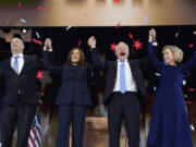 Vice President and Democratic presidential nominee Kamala Harris stands with second gentleman Doug Emhoff, left, vice presidential nominee Minnesota Governor Tim Walz and his wife Gwen Walz, right, following Harris&rsquo; acceptance speech at the Democratic National Convention in Chicago, on Aug. 22, 2024.