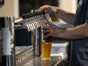 Washington State University professor Michael Goldsby believes that beer could save democracy by opening people to conversations.