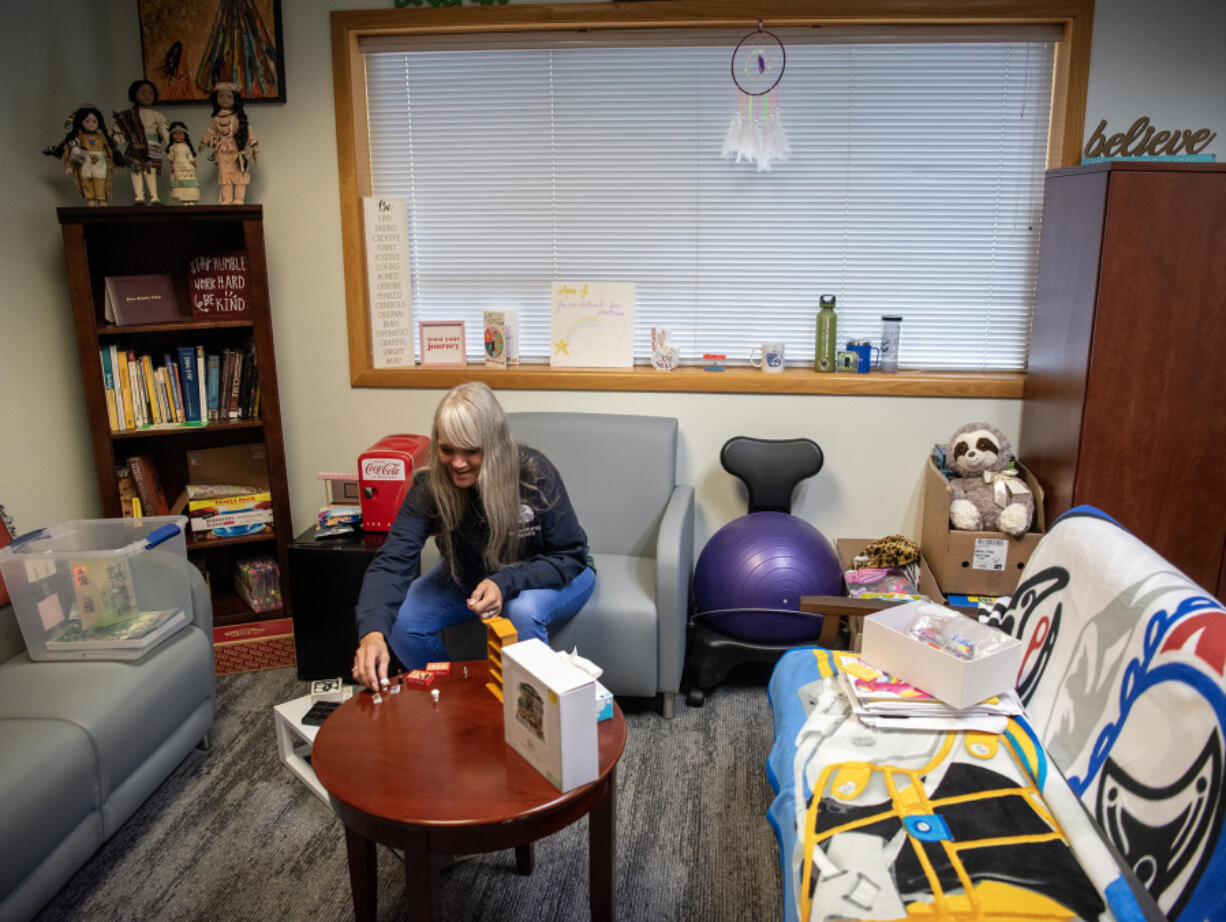 Substance use disorder professional Amie-Jo Brassfield sits in her office where she meets with youth at the Cowlitz Indian Tribe Health and Human Services office in Hazel Dell. The tribe recently started offering behavioral health services to youth there.