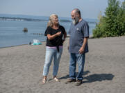 Barbara James, Fort Vancouver High School Class of 1981, left, joins metal detectorist Craig Nichols, revisit the spot where Nichols found her class ring at Wintler Park. Nichols recovered and returned the ring that had been missing for 42 years.