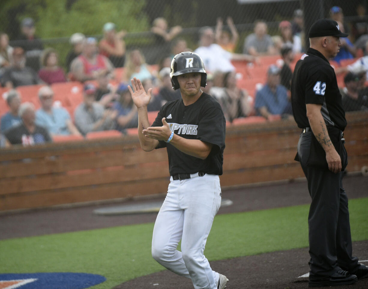 Taylor Takata of the Ridgefield Raptors celebrates after scoring a run in the second inning of the Raptors' game against the Springfield Drifters at the Ridgefied Outdoor Recreation Center on Saturday, Aug. 3, 2024.