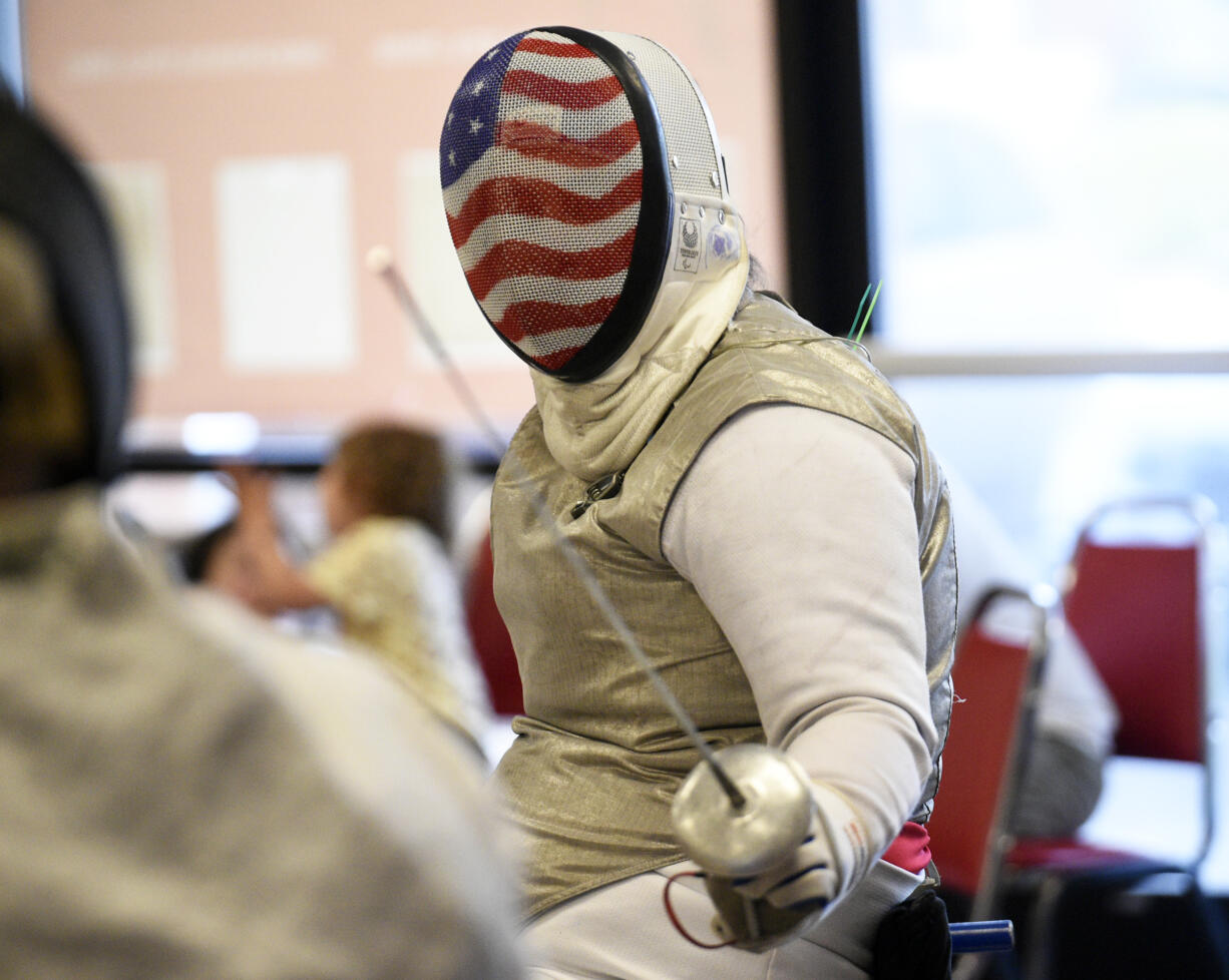 Ellen Geddes competes in a Walk and Roll Tournament at Orion Fencing in Orchards on Saturday, Aug. 3, 2024, as a send-off to her as she prepares to compete in wheelchair fencing at the Paralympic Games in Paris.