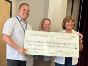 Dave Cole, executive director of the Cascadia Tech Academy Foundation, left, with Kim Chenault and Robin Bean, co-chairs of the Clark County Newcomers club Fundraising Committee.