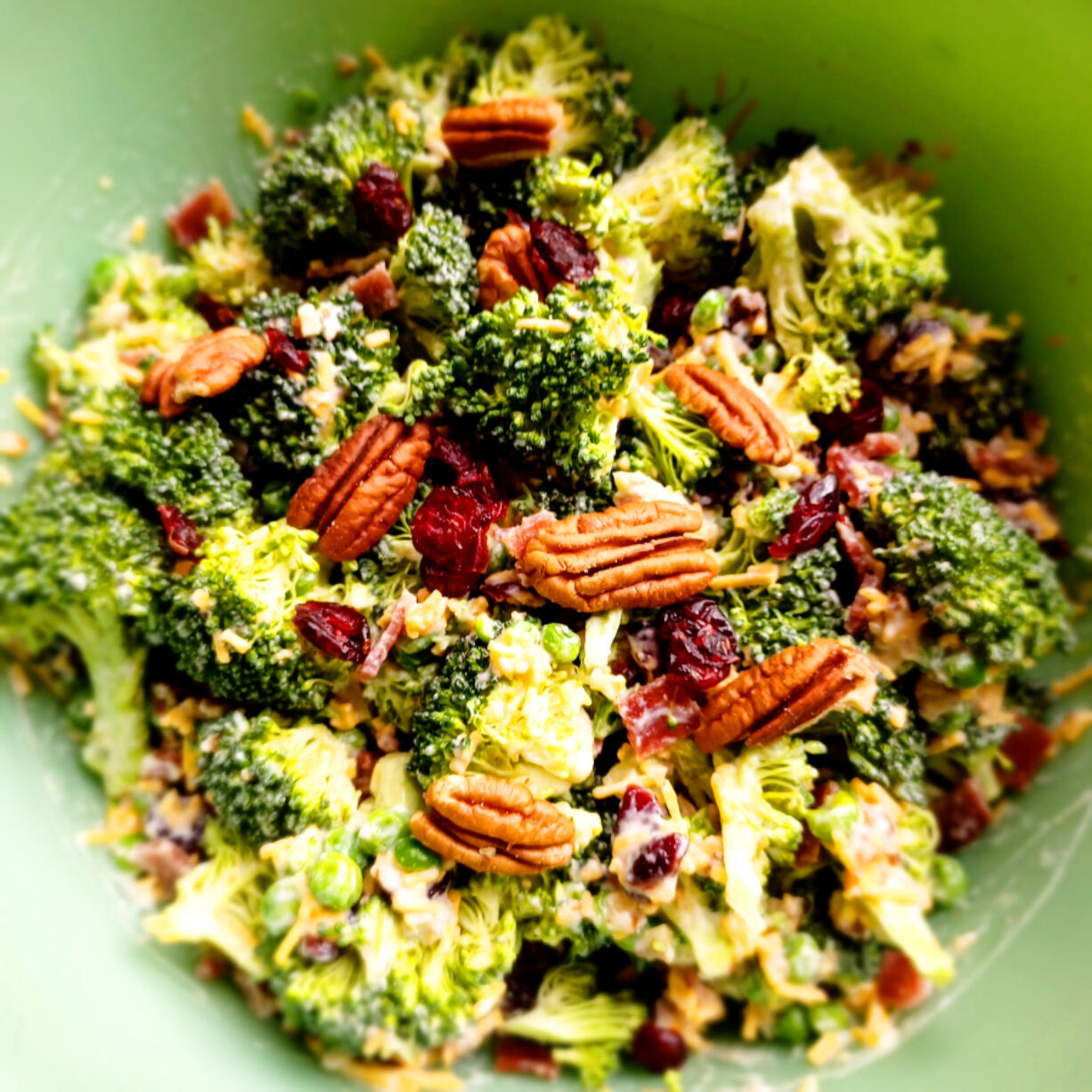 With broccoli, bacon, cheese, nuts and cranberries, this crunch-tangy-sweet broccoli salad is a winner.