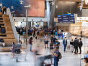 Travelers move around the new main terminal of Portland International Airport on Wednesday, Aug. 14, 2024, at PDX. Opening the new main terminal to the public marked the end of phase 1 of the PDX Next project, with phase 2 and the completion of all construction scheduled to wrap up in Spring 2026.