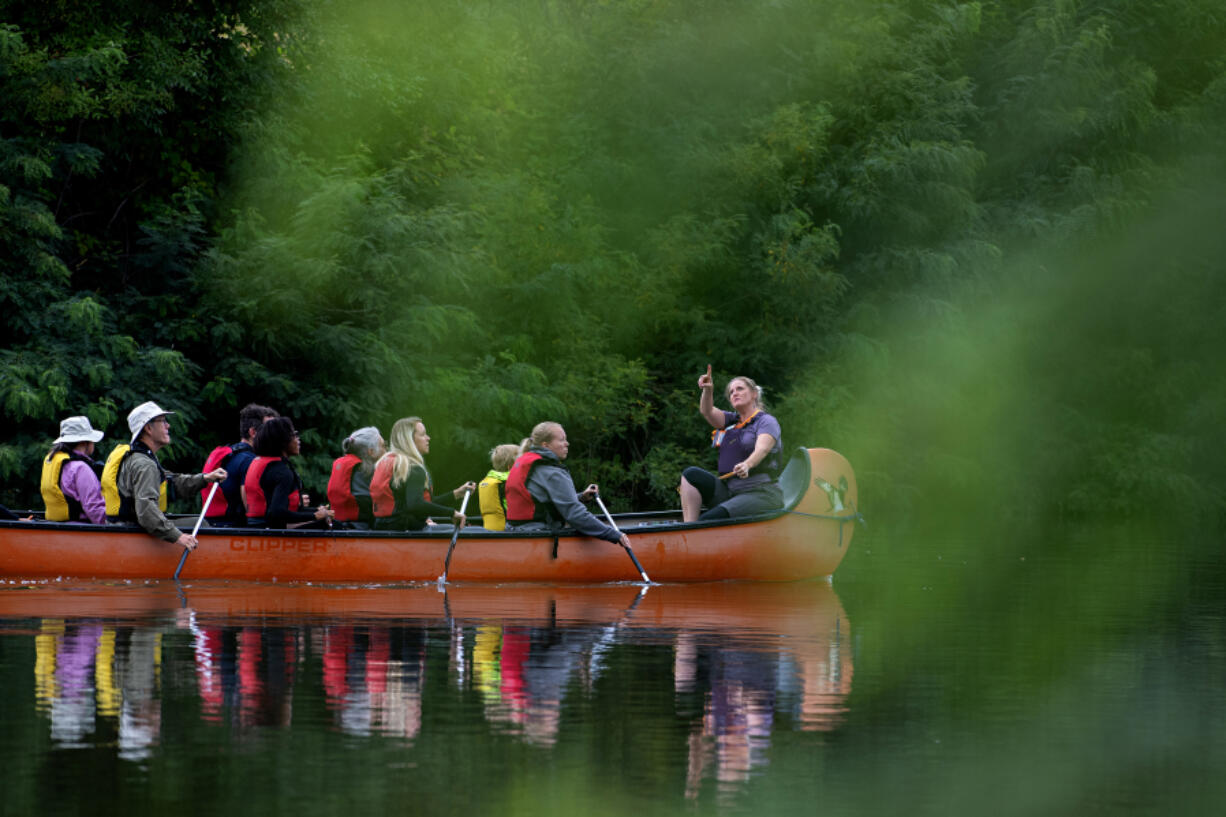 Rainy Rau of the Water Resources Education Center leads a canoe tour after leaving Felida Moorage &amp; Marine Service on Thursday morning. Paddlers had the opportunity to learn about wildlife, water quality and treatment plans for the algae during the excursion.