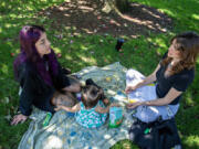 Isabella Lippelgoos of Vancouver, from left, joins her daughter, Rosemary Luna, 14 months, as they work with Clark County nurse Ariel Magram during a visit at Jaggy Road Park on Monday afternoon. Clark County Public Health&rsquo;s Nurse-Family Partnership assists low-income moms from pregnancy until their child&rsquo;s second birthday.