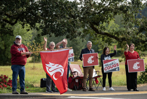 Washington State University Vancouver supporters and faculty greet students on the first day of classes Monday morning.