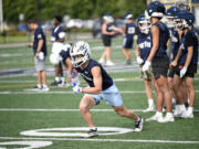 Joe Callerame of Seton Catholic goes through drills on the first day of football practice at Seton High School on Wednesday, Aug. 21, 2024.