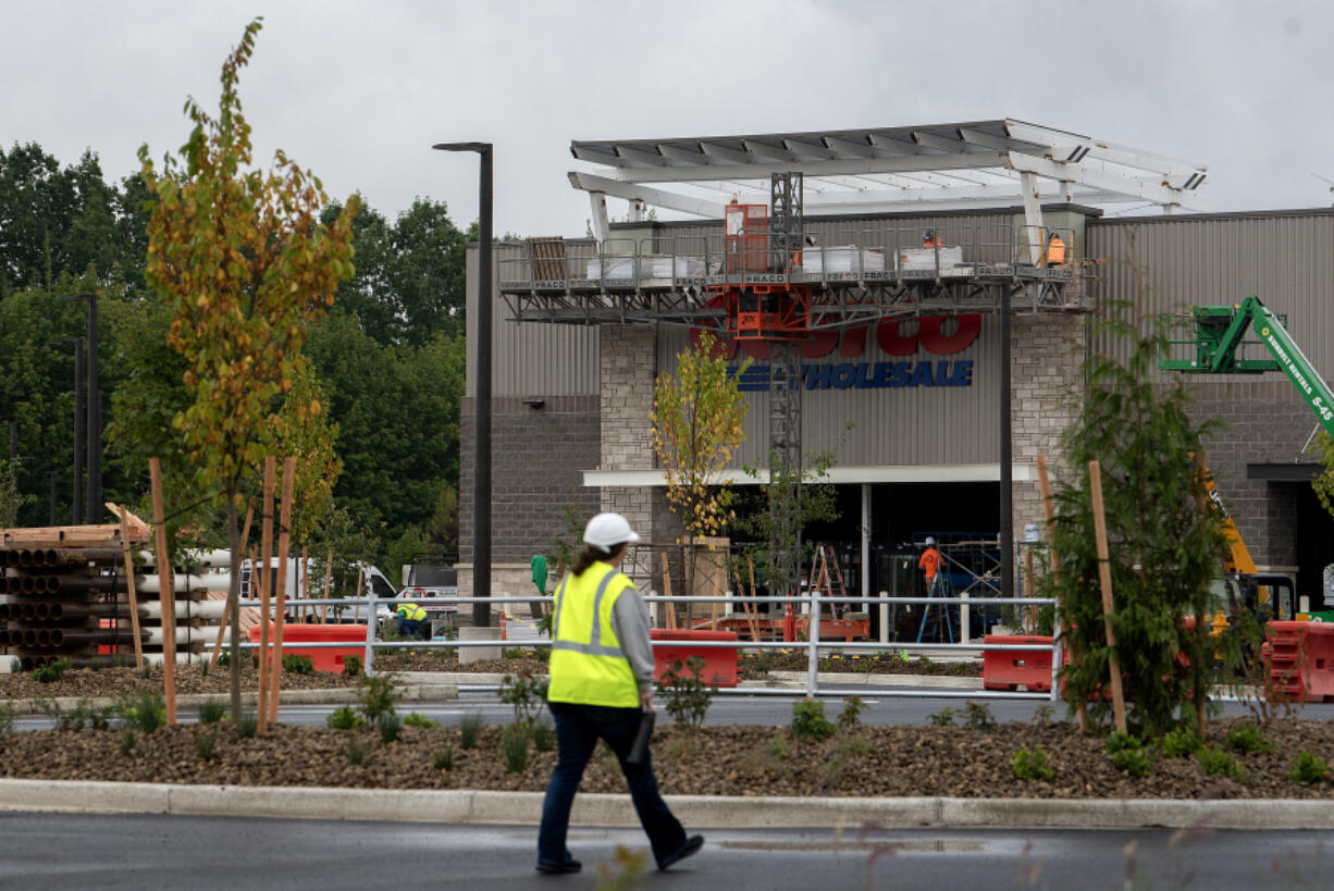 Construction crews prepare the new Costco store in Ridgefield for its Thursday opening day. Ridgefield city officials have been working with local and state agencies on plans to handle the expected influx of traffic.