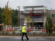 Construction crews prepare the new Costco store in Ridgefield for its Thursday opening day. Ridgefield city officials have been working with local and state agencies on plans to handle the expected influx of traffic.