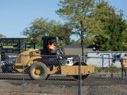 Construction workers make way for a new building to house Shake Shack and Starbucks at Fisher&rsquo;s Landing Marketplace. Daiso is also expected to open at the shopping center later this year.