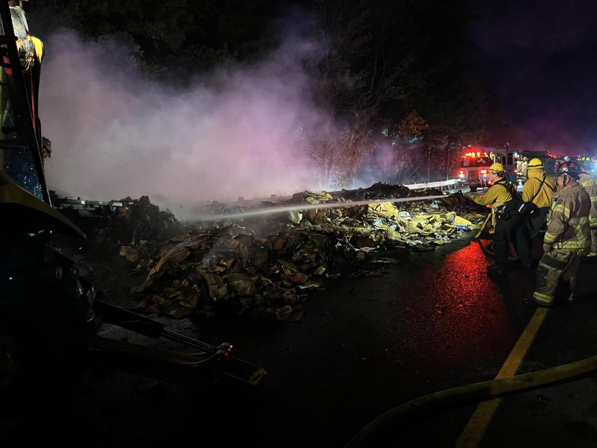 A semi hauling cardboard bales caught fire Tuesday night along Interstate 84 near Hood River, Ore., forcing the freeway to close.