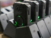 Axon body cameras charge on a docking station at Oklahoma City police headquarters on Friday, May 31, 2024 in Oklahoma City, Oklahoma.