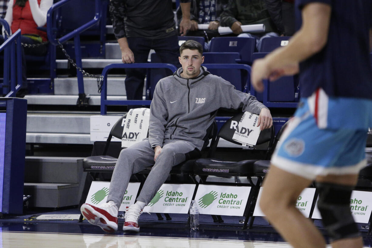 Gonzaga guard Steele Venters, who is out for the season with an ACL injury, watches his teammates warm up before an NCAA college basketball game against Yale, Friday, Nov. 10, 2023, in Spokane, Wash.