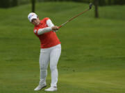 Moriya Jutanugarn, of Thailand, hits an approach shot on the sixth hole during the first round of the Mizuho Americas Open golf tournament, Thursday, May 16, 2024, in Jersey City, N.J.