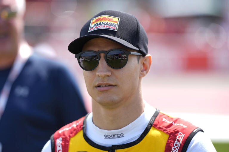 Alex Palou walks to driver introductions before an IndyCar auto race, Sunday, July 14, 2024, at Iowa Speedway in Newton, Iowa.