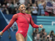 Simone Biles, of the United States, smiles after competing during the women's artistic gymnastics individual vault finals at Bercy Arena at the 2024 Summer Olympics, Saturday, Aug. 3, 2024, in Paris, France.