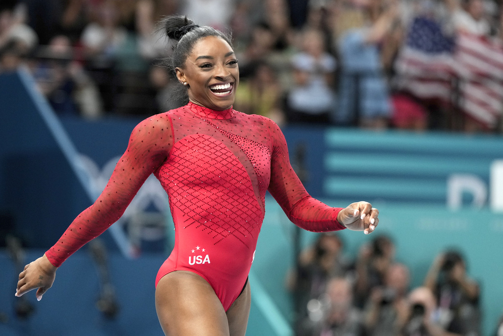 Simone Biles, of the United States, smiles after competing during the women's artistic gymnastics individual vault finals at Bercy Arena at the 2024 Summer Olympics, Saturday, Aug. 3, 2024, in Paris, France.