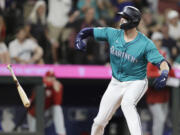 Seattle Mariners' Mitch Haniger reacts after drawing a walk-off walk to win 6-5 during the 10th inning against the Philadelphia Phillies in a baseball game Saturday, Aug. 3, 2024, in Seattle.