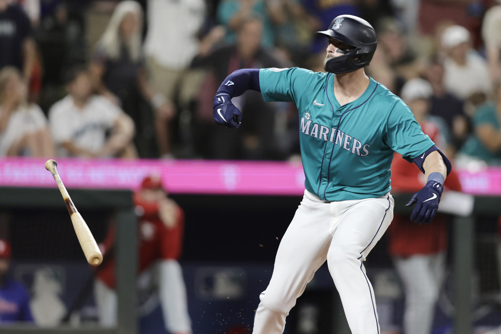 Seattle Mariners' Mitch Haniger reacts after drawing a walk-off walk to win 6-5 during the 10th inning against the Philadelphia Phillies in a baseball game Saturday, Aug. 3, 2024, in Seattle.