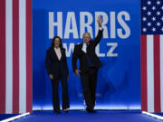 Democratic presidential nominee Vice President Kamala Harris and her running mate Minnesota Gov. Tim Walz arrive at a campaign rally in Philadelphia, Tuesday, Aug. 6, 2024.