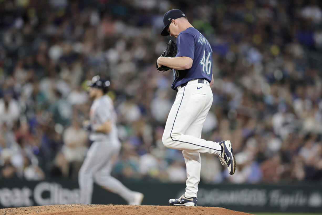 Seattle Mariners pitcher Trent Thornton kicks the mound as Detroit Tigers' Parker Meadows, back, rounds the bases on his solo home run during the eighth inning in a baseball game, Tuesday, Aug. 6, 2024, in Seattle.