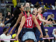 Players for the United States celebrate during a semifinal women's volleyball match against Brazil at the 2024 Summer Olympics, Thursday, Aug. 8, 2024, in Paris, France.