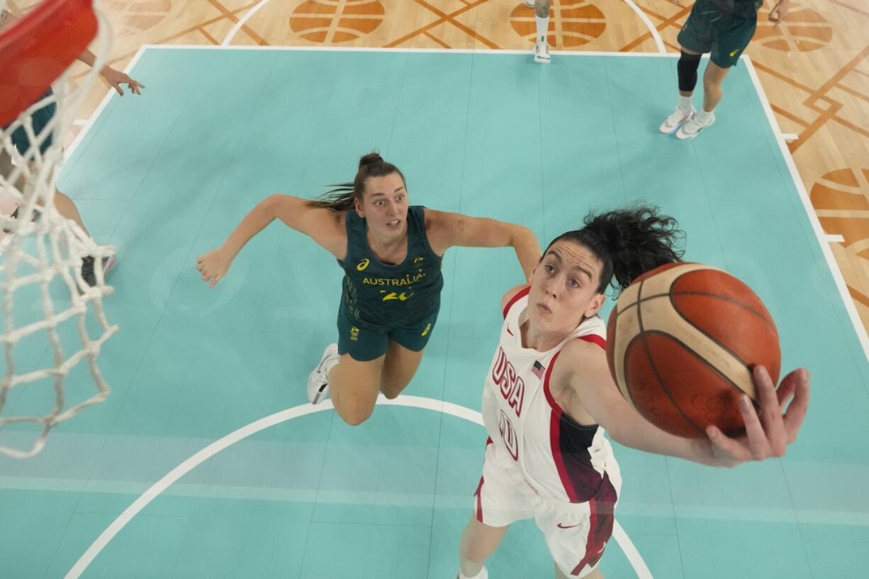 United States' Breanna Stewart (10) shoots past Isobel Borlase (20), of Australia, during a women's semifinal basketball game at Bercy Arena at the 2024 Summer Olympics, Friday, Aug. 9, 2024, in Paris, France.