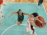 United States' Breanna Stewart (10) shoots past Isobel Borlase (20), of Australia, during a women's semifinal basketball game at Bercy Arena at the 2024 Summer Olympics, Friday, Aug. 9, 2024, in Paris, France.