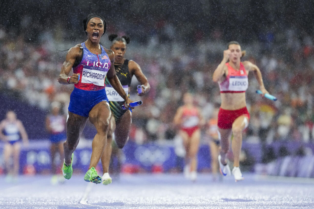 Sha'carri Richardson, of the United States, celebrates after winning the women's 4 x 100-meter relay final at the 2024 Summer Olympics, Friday, Aug. 9, 2024, in Saint-Denis, France.