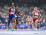 Sha'carri Richardson, of the United States, celebrates after winning the women's 4 x 100-meter relay final at the 2024 Summer Olympics, Friday, Aug. 9, 2024, in Saint-Denis, France.