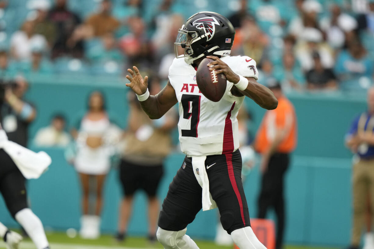 Atlanta Falcons quarterback Michael Penix Jr. (9) aims a pass during the first half of a pre season NFL football game against the Miami Dolphins, Friday, Aug. 9, 2024, in Miami Gardens, Fla.